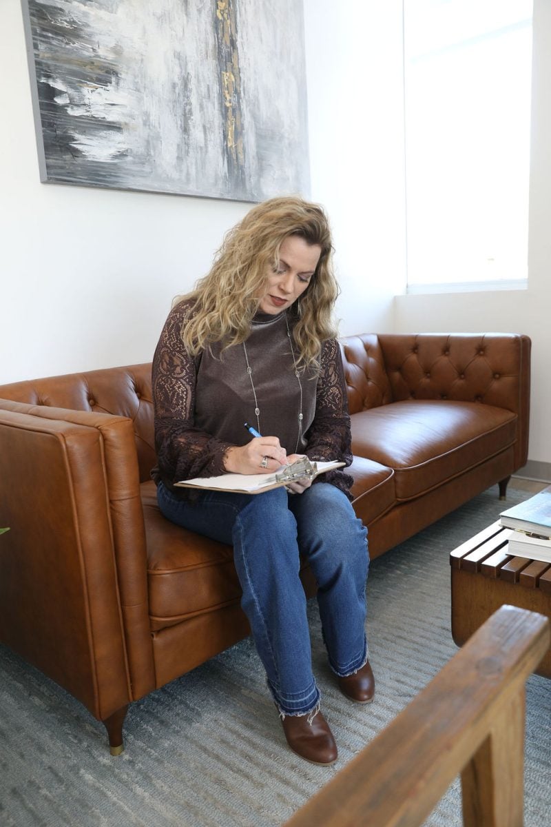 woman writing in the notebook